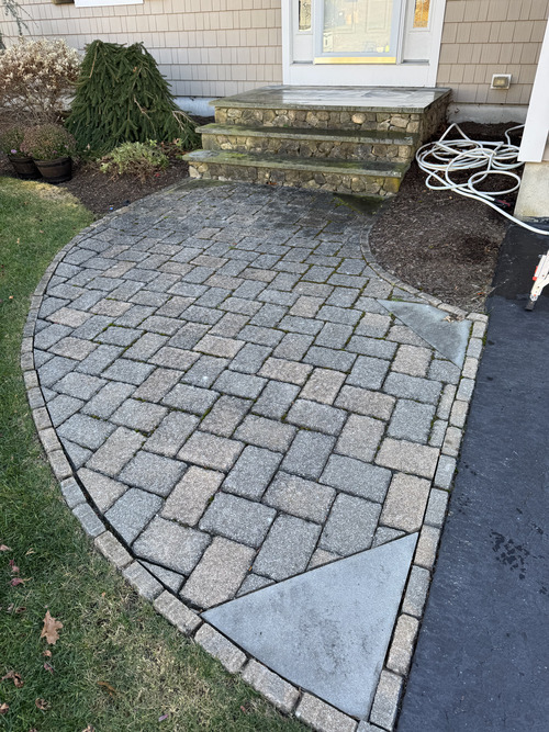 Paver walkway before professional exterior cleaning
